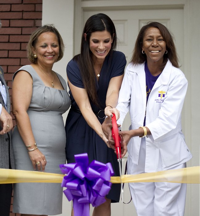 Sandra Bullock, ribbon cutting, navy dress, black heels